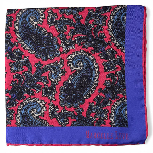 Paisley patterned pocket square with blue and red colors on a white background
