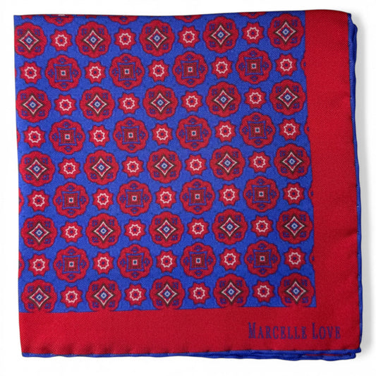 Red and blue patterned pocket square with 'Marcelle Love' branding