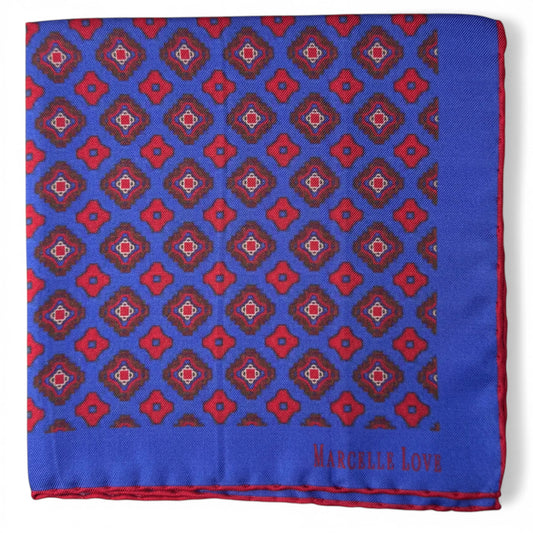 Blue pocket square with red geometric pattern and 'Marcelle Love' branding