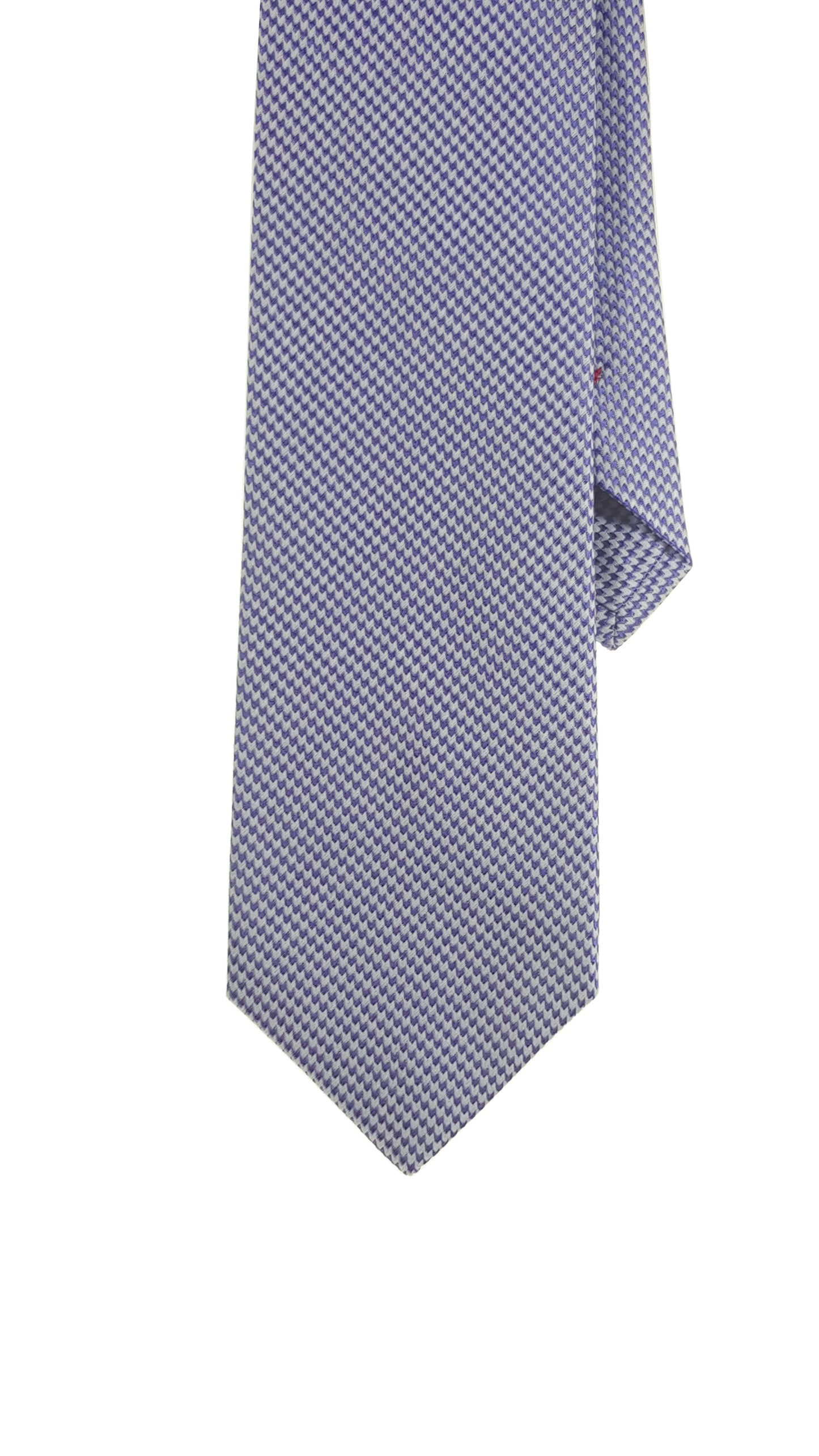 A blue silk tie with a houndstooth pattern.