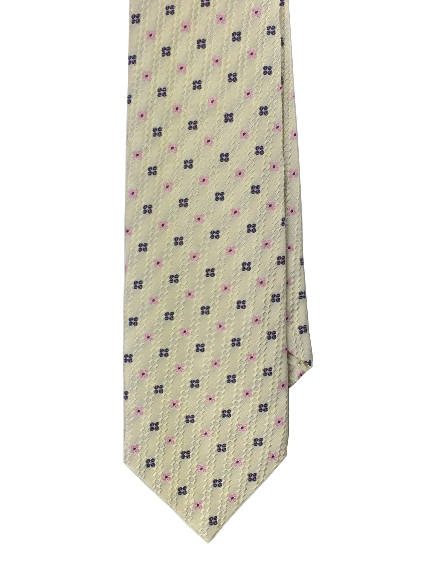 A cream-colored traditional woven tie with a navy blue pattern and a 4 leaf clover design,