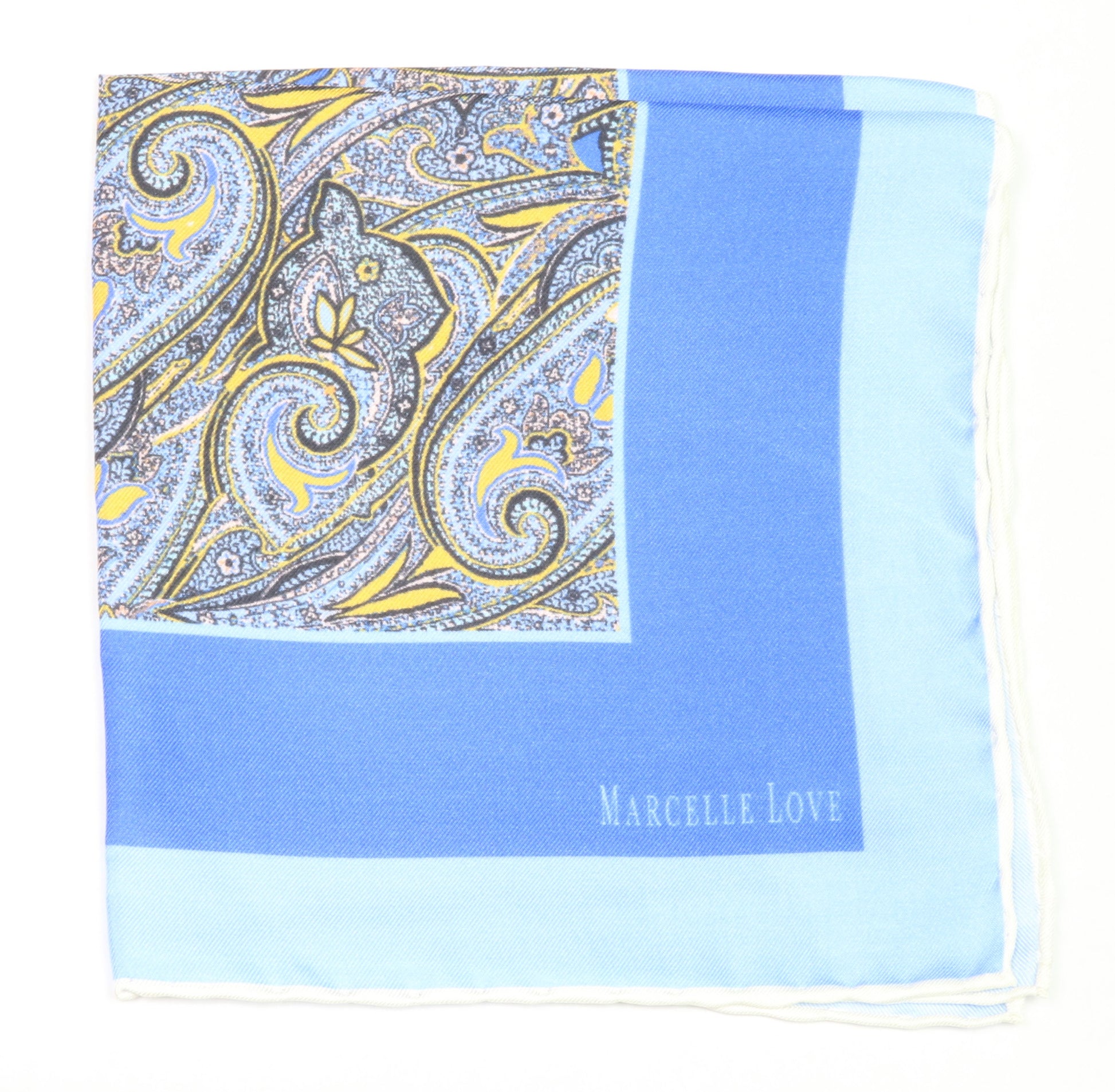A blue pocket square with a paisley print and the brand name 'MARCELLE LOVE' printed at the bottom right corner.